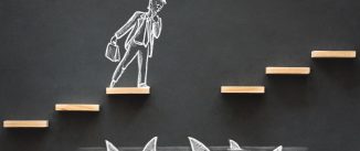 Hand-drawn chalk picture of an executive on steps over sharks with one step missing