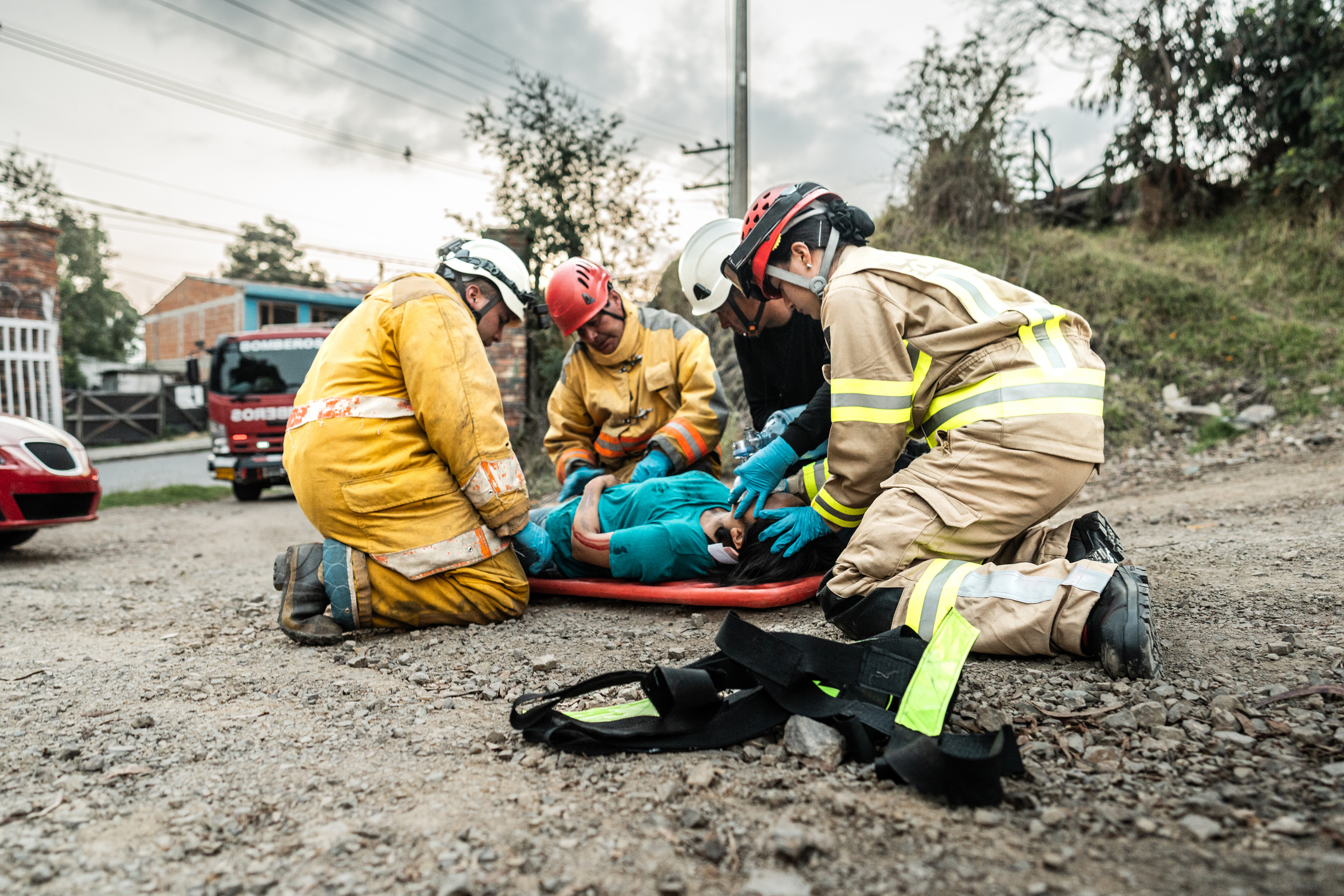 Firefighters helping a car accident victim